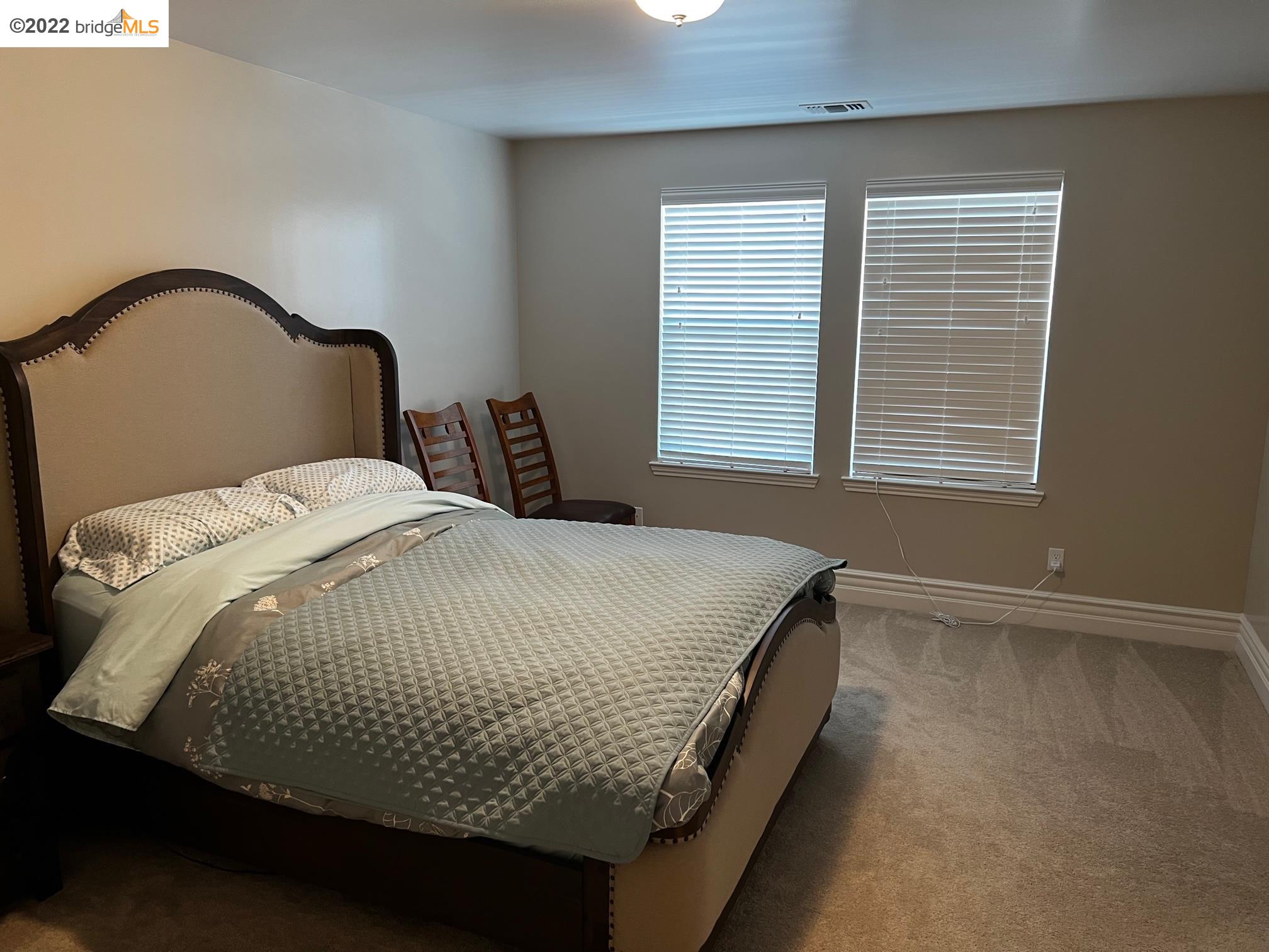 East Garrison Marina, CA 93933 - Photo 11 of 11 a bed sitting in a bedroom next to a window