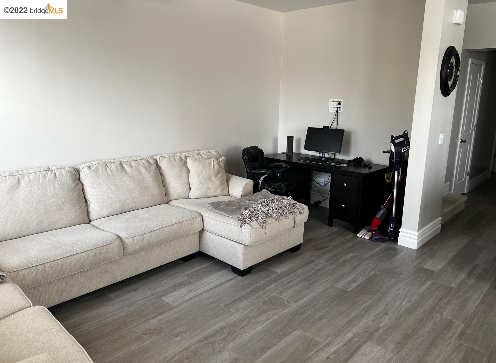 East Garrison Marina, CA 93933 - Photo 2 of 11 a living room with furniture and a wooden floor