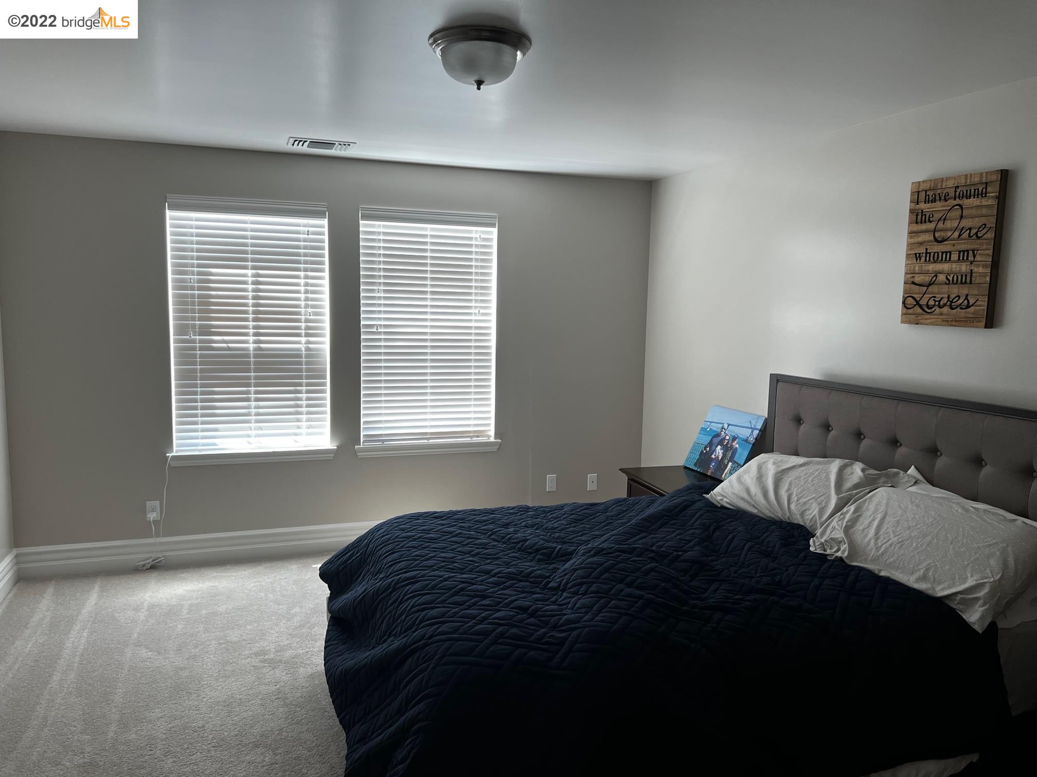East Garrison Marina, CA 93933 - Photo 9 of 11 a bedroom with a bed and a window