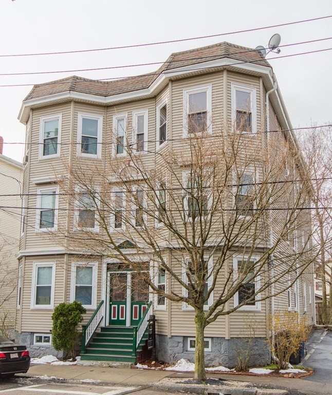 126 Minden Street, Unit 3 Boston, MA 02130 - Photo 12 of 12 a front view of a house with a yard
