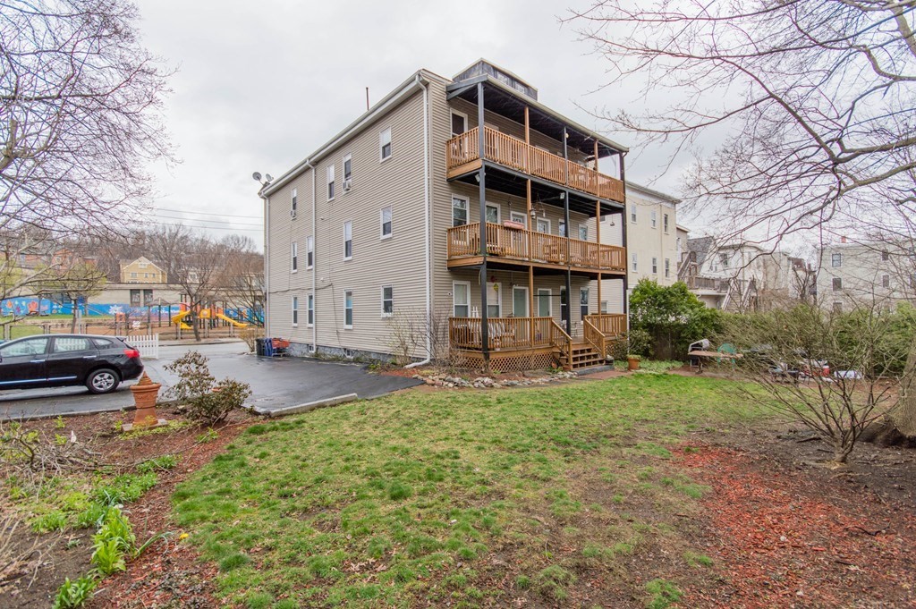 126 Minden Street, Unit 3 Boston, MA 02130 - Photo 10 of 12 a view of a house with a yard