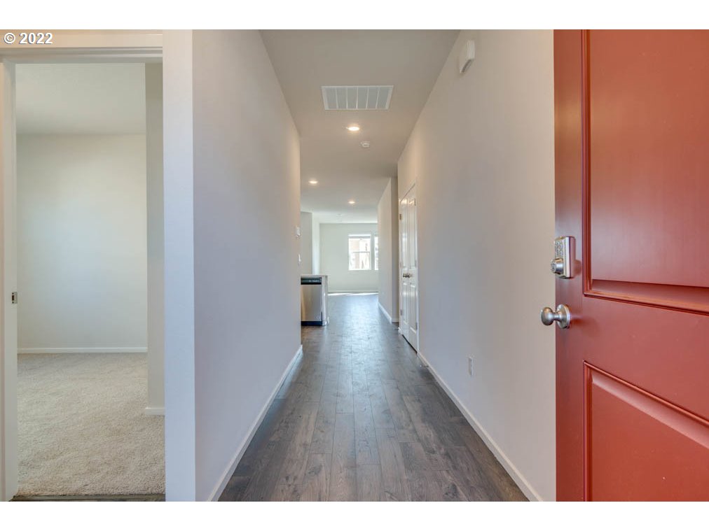 Undisclosed Address Eugene, OR 97404 - Photo 3 of 19 a view of hallway with wooden floor