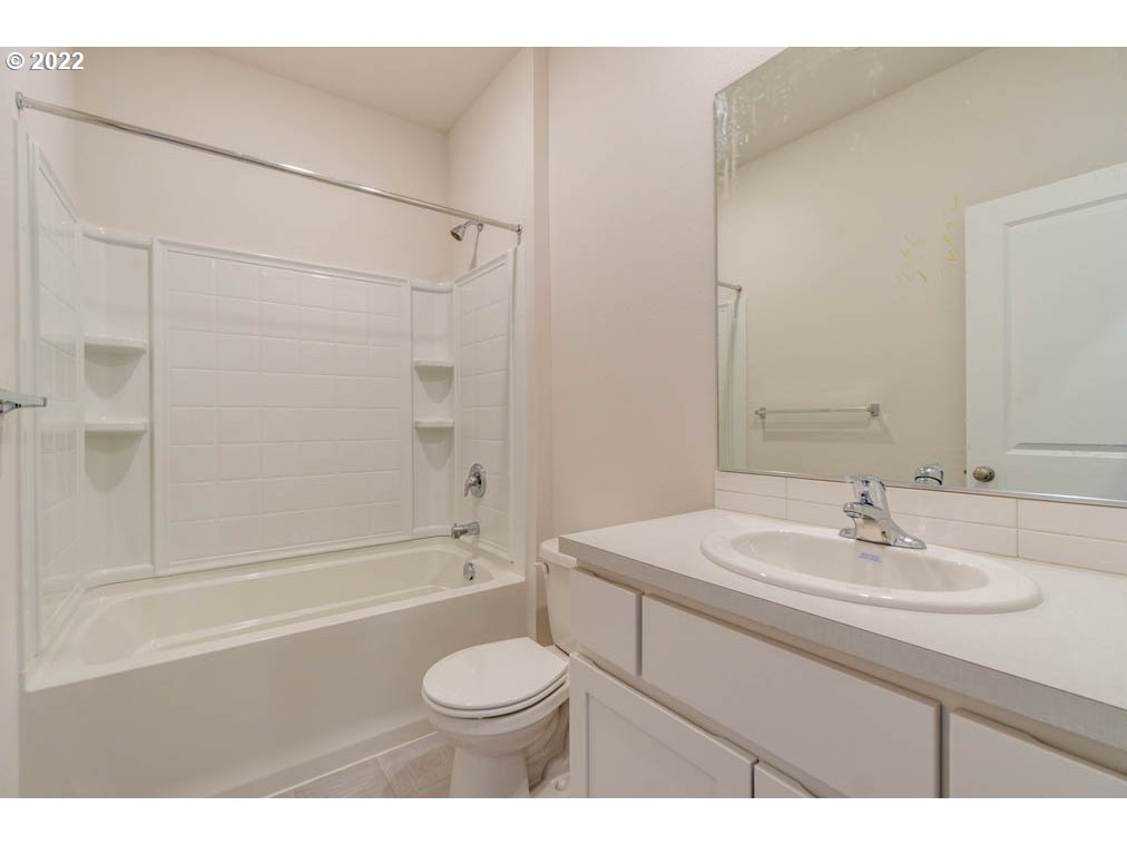 Undisclosed Address Eugene, OR 97404 - Photo 6 of 19 a bathroom with a sink a toilet and a bathtub