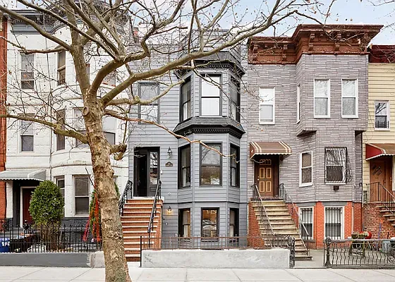 a front view of a building with large windows