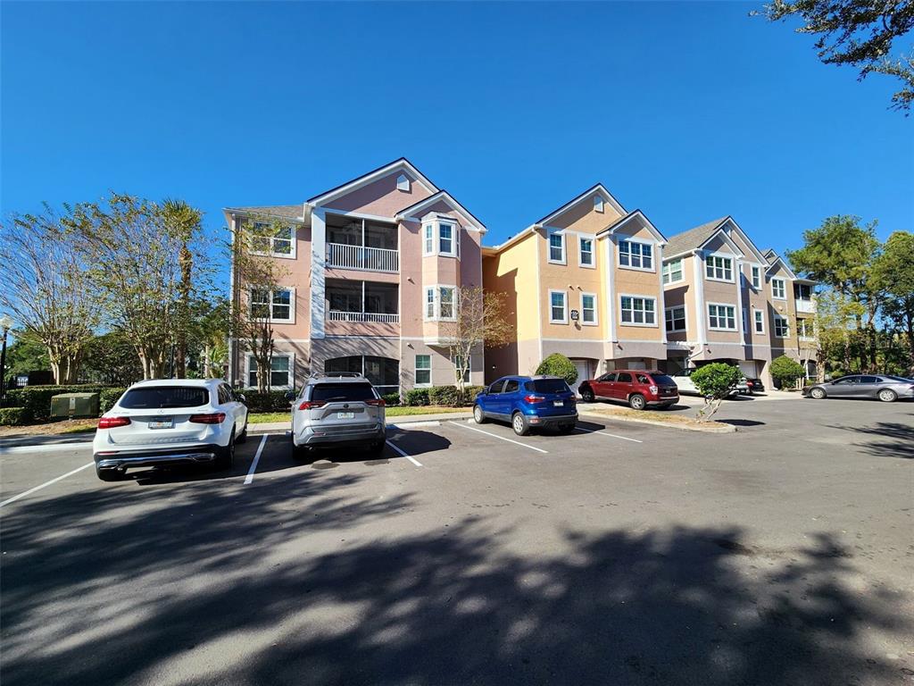 3250 Corona Village Way, Unit 101 Orlando, FL 32835 - Photo 2 of 31 a view of a city street with cars