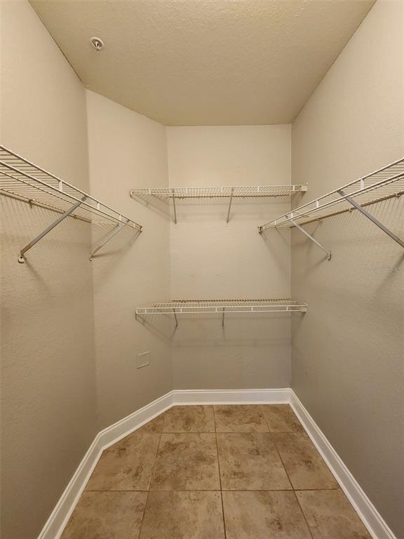 3250 Corona Village Way, Unit 101 Orlando, FL 32835 - Photo 22 of 31 a view of a room with racks on the wall