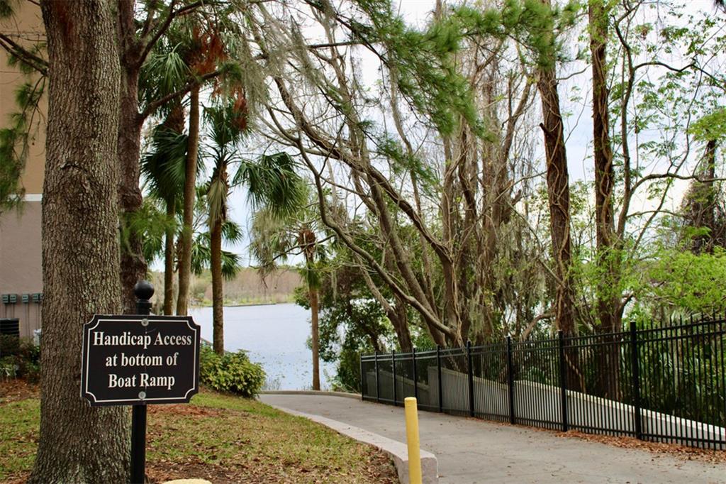 3250 Corona Village Way, Unit 101 Orlando, FL 32835 - Photo 26 of 31 a view of a street with trees