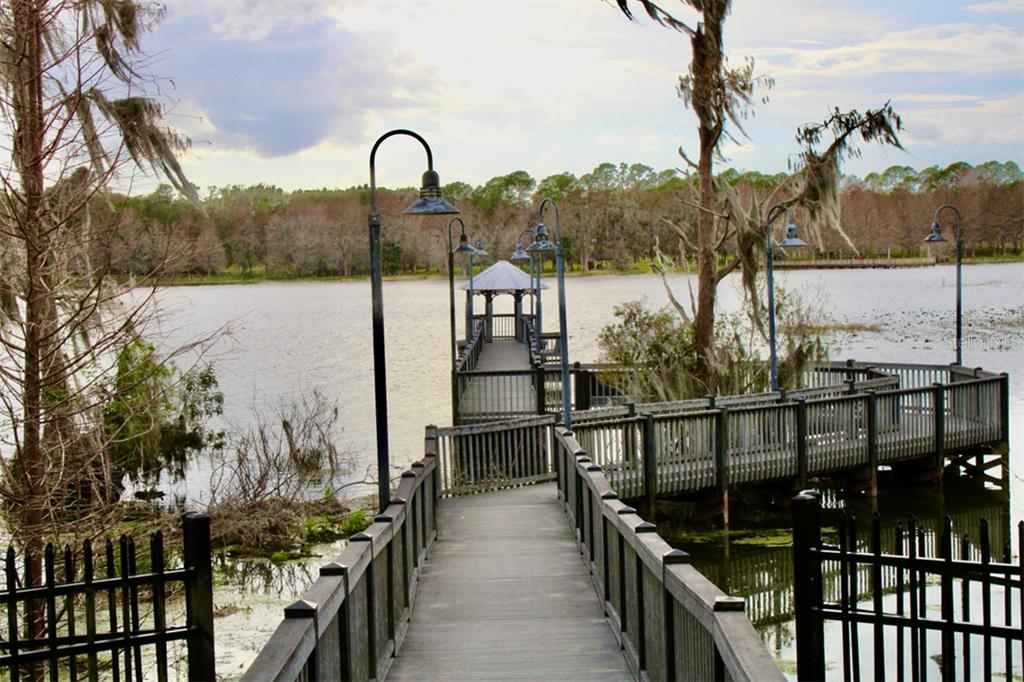 3250 Corona Village Way, Unit 101 Orlando, FL 32835 - Photo 27 of 31 a view of a lake from a balcony