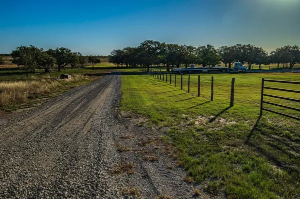 a view of a lake with houses in the back