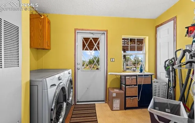 a view of a room with furniture and windows