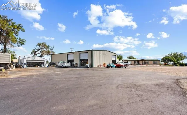 a view of yard with patio