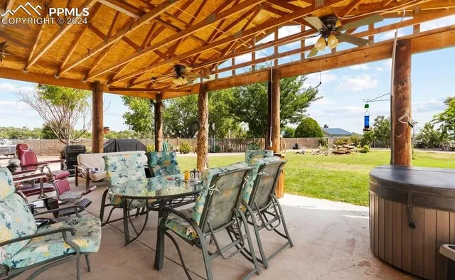 an aerial view of a house with outdoor space patio and lake view