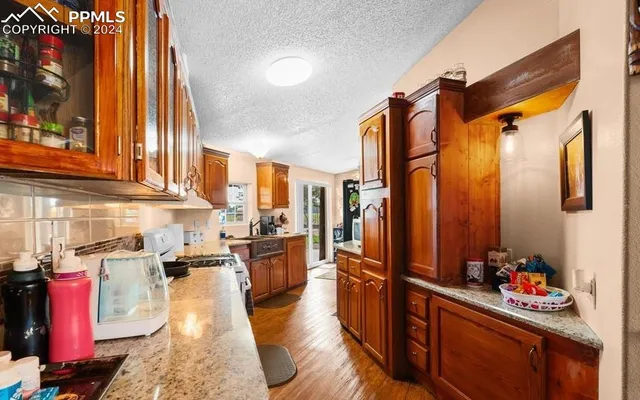 a hallway with a large window and couch