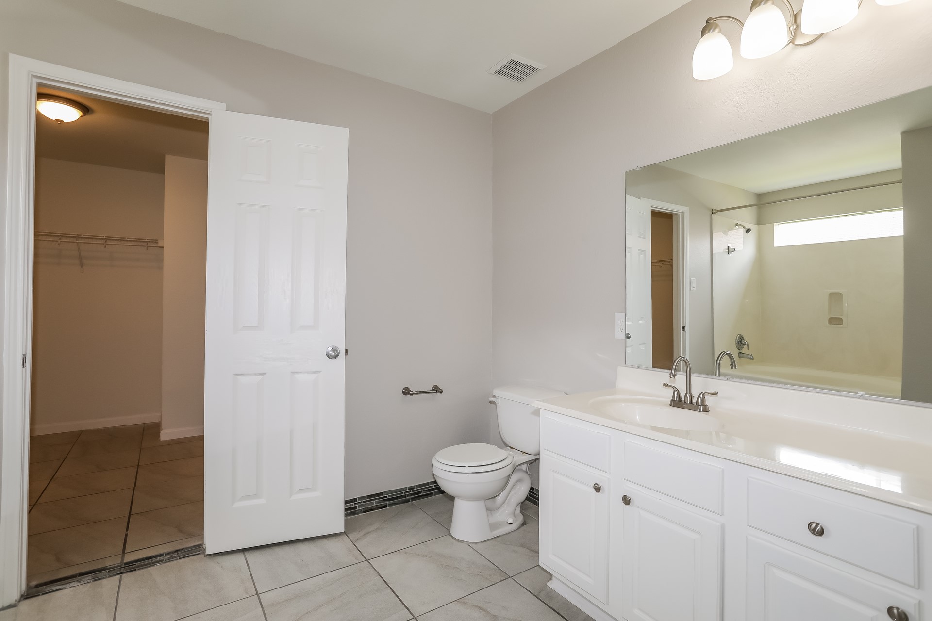 29511 Legends Pine Lane Spring, TX 77386 - Photo 11 of 17 a bathroom with a granite countertop sink a toilet and a mirror