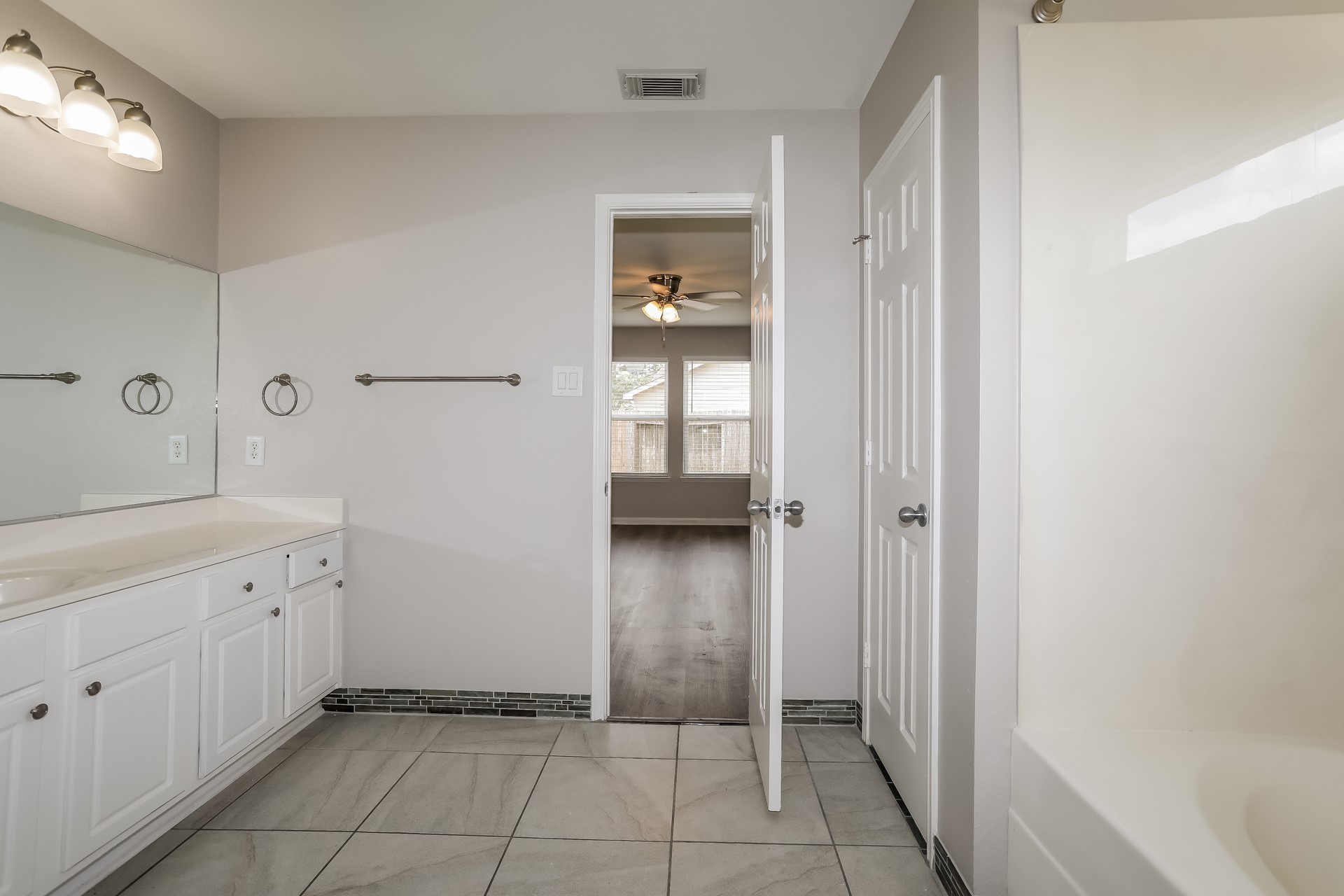 29511 Legends Pine Lane Spring, TX 77386 - Photo 12 of 17 a bathroom with a sink and a mirror