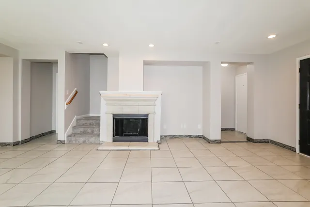 a kitchen with a refrigerator sink and cabinets