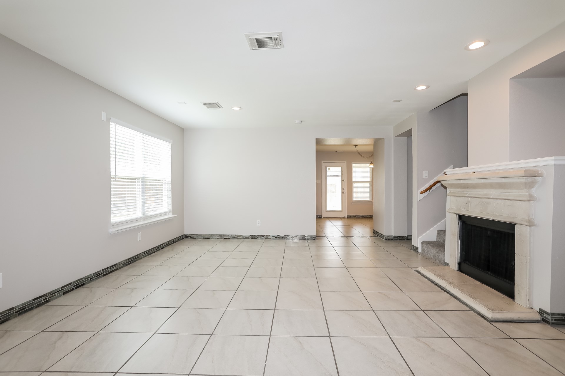 29511 Legends Pine Lane Spring, TX 77386 - Photo 5 of 17 a view of an empty room with a fireplace and a window