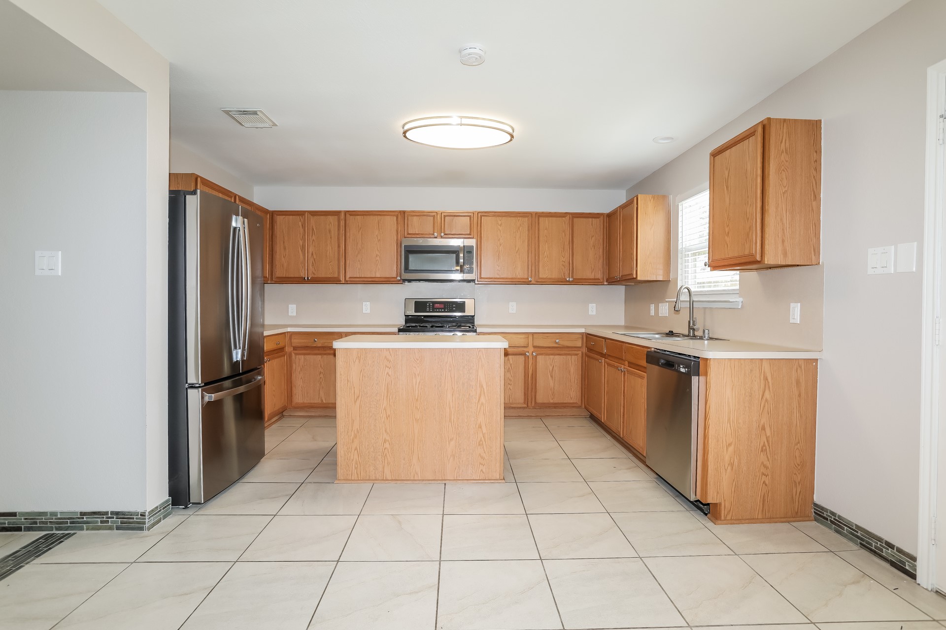 29511 Legends Pine Lane Spring, TX 77386 - Photo 7 of 17 a kitchen with stainless steel appliances granite countertop a stove top oven a sink a counter top space and cabinets