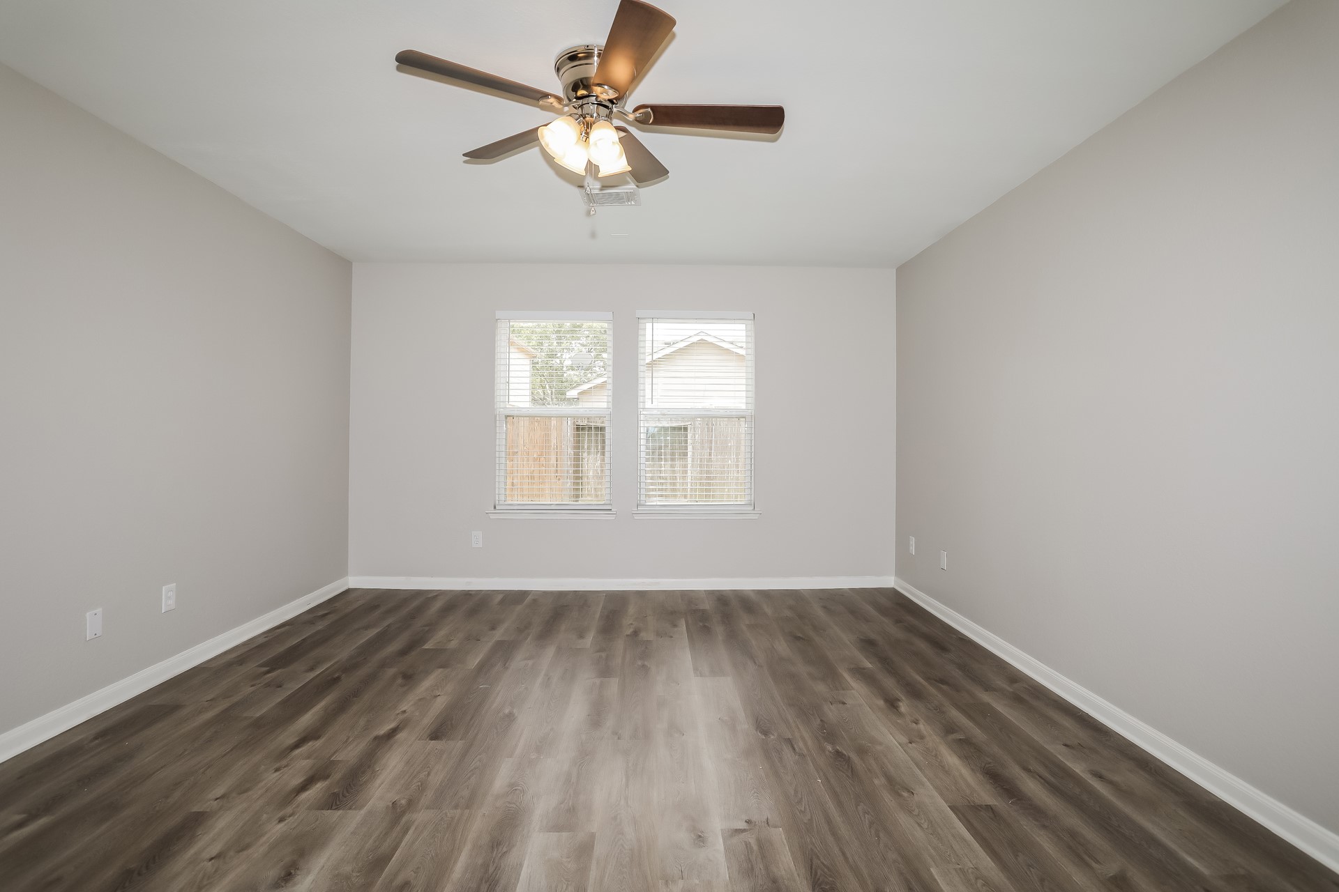 29511 Legends Pine Lane Spring, TX 77386 - Photo 9 of 17 wooden floor in an empty room with a window
