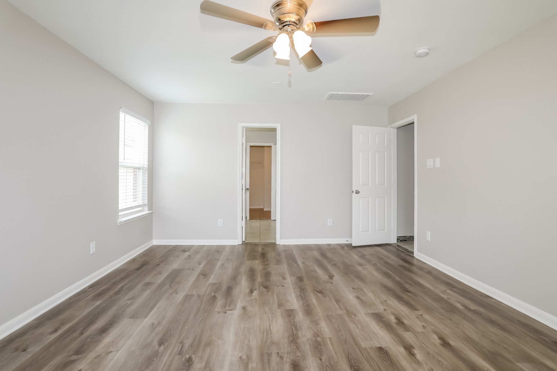 29511 Legends Pine Lane Spring, TX 77386 - Photo 10 of 17 wooden floor in an empty room with a window