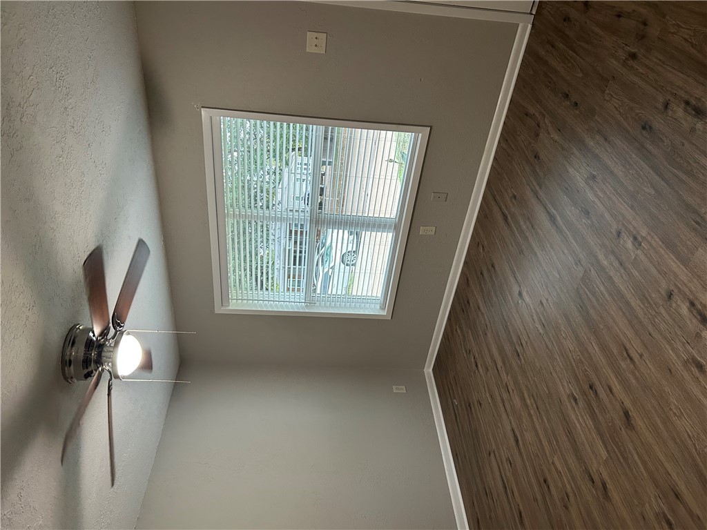 916 South Gordon Street Bryan, TX 77803 - Photo 8 of 8 a view of an empty room with wooden floor and a window