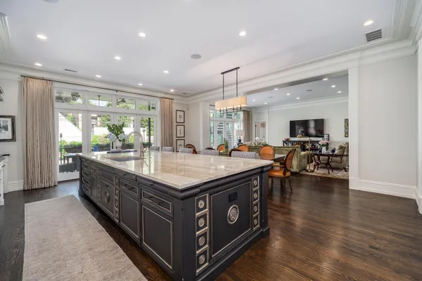a kitchen with a stove a sink and a refrigerator