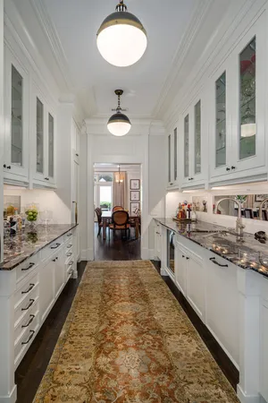 a kitchen with stainless steel appliances a stove and cabinets