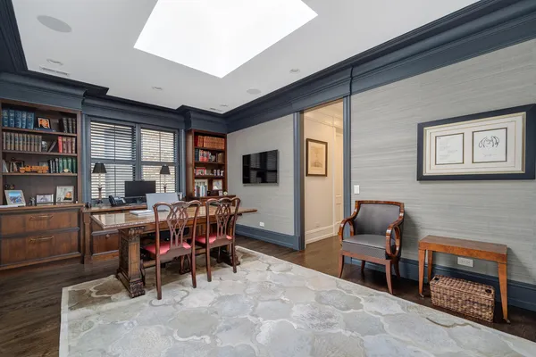 a bedroom with furniture and a window
