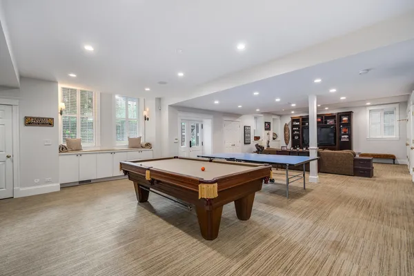 a kitchen with kitchen island granite countertop stainless steel appliances stove microwave and cabinets