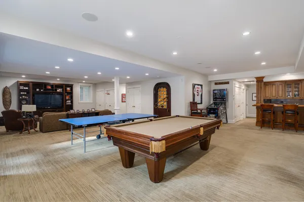 a living room with furniture and kitchen view