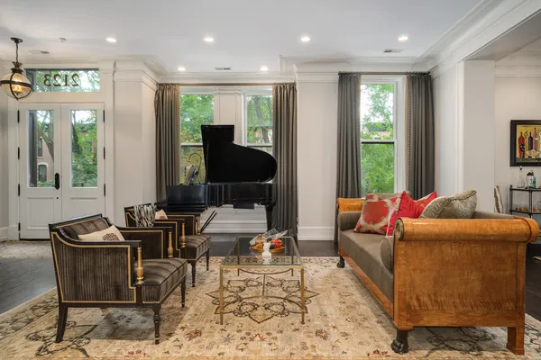 a view of a livingroom with furniture window and wooden floor