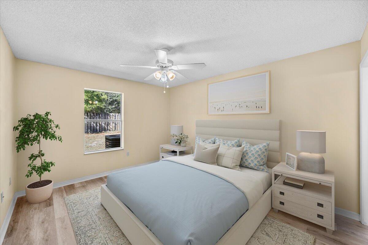 104 Cabana Way Crestview, FL 32536 - Photo 1 of 25 a bedroom with a large bed and a window
