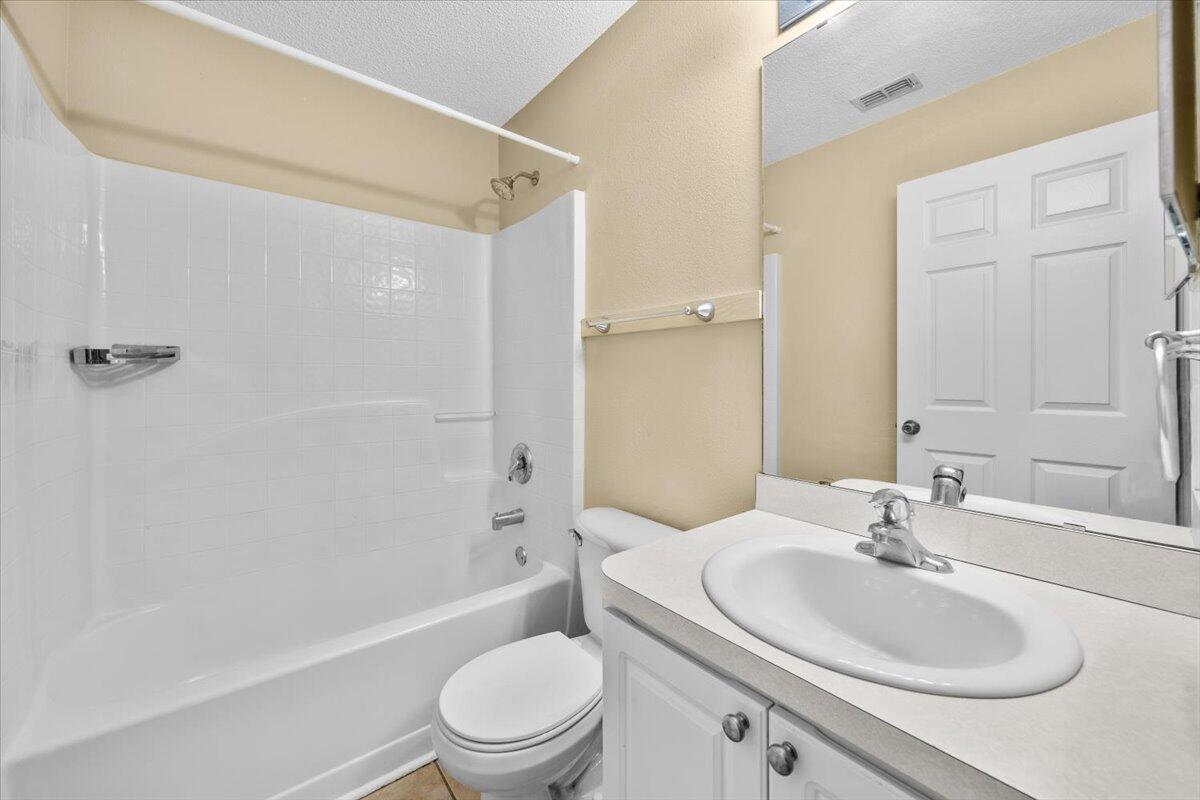 104 Cabana Way Crestview, FL 32536 - Photo 20 of 25 a bathroom with a sink toilet and shower
