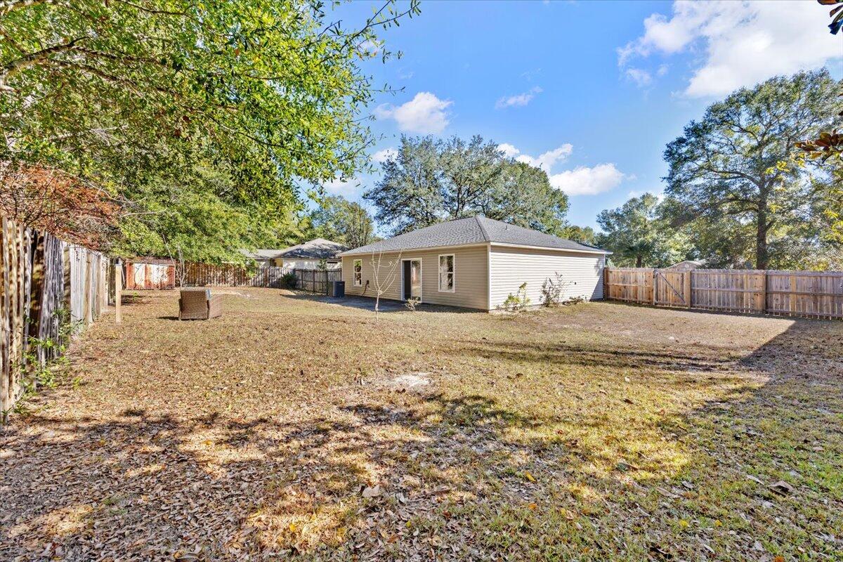 104 Cabana Way Crestview, FL 32536 - Photo 23 of 25 a front view of house with a garden
