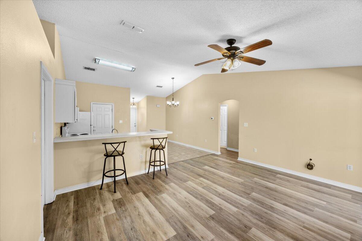 104 Cabana Way Crestview, FL 32536 - Photo 6 of 25 a view of a workspace with furniture and a wooden floor