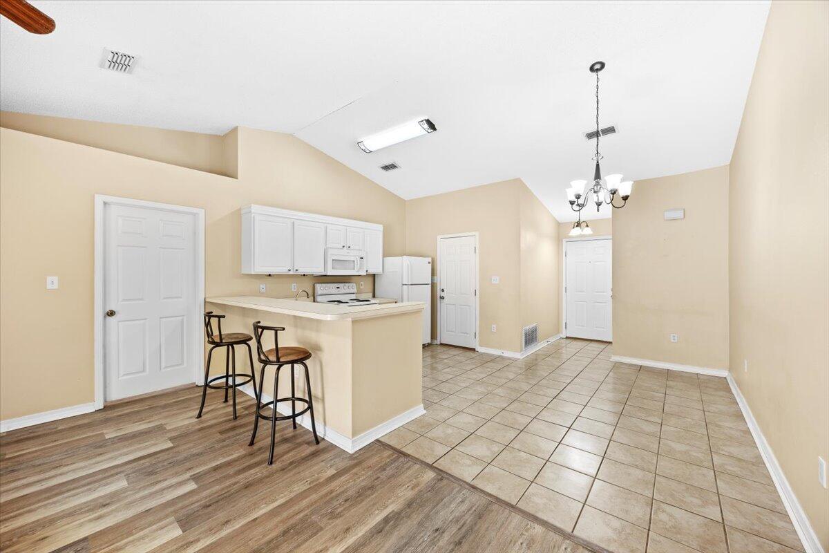 104 Cabana Way Crestview, FL 32536 - Photo 7 of 25 a view of a kitchen with sink microwave and cabinets