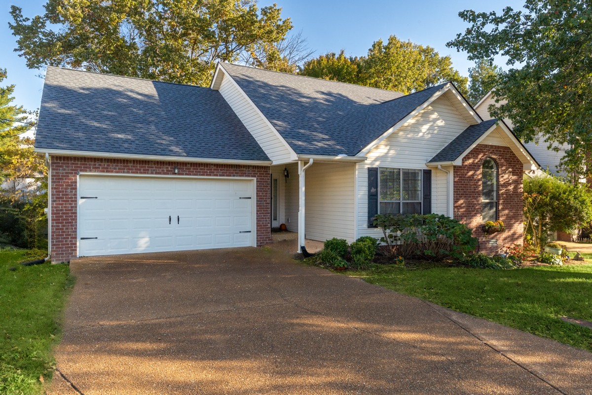 3817 Bryce Road Nashville, TN 37211 - Photo 2 of 26 a front view of a house with a yard and garage
