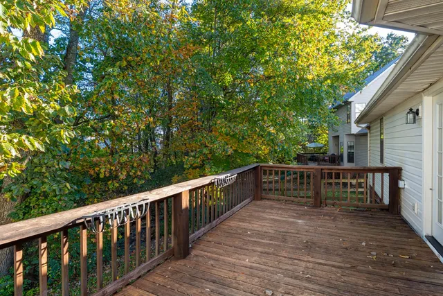 a view of balcony with furniture and wooden deck