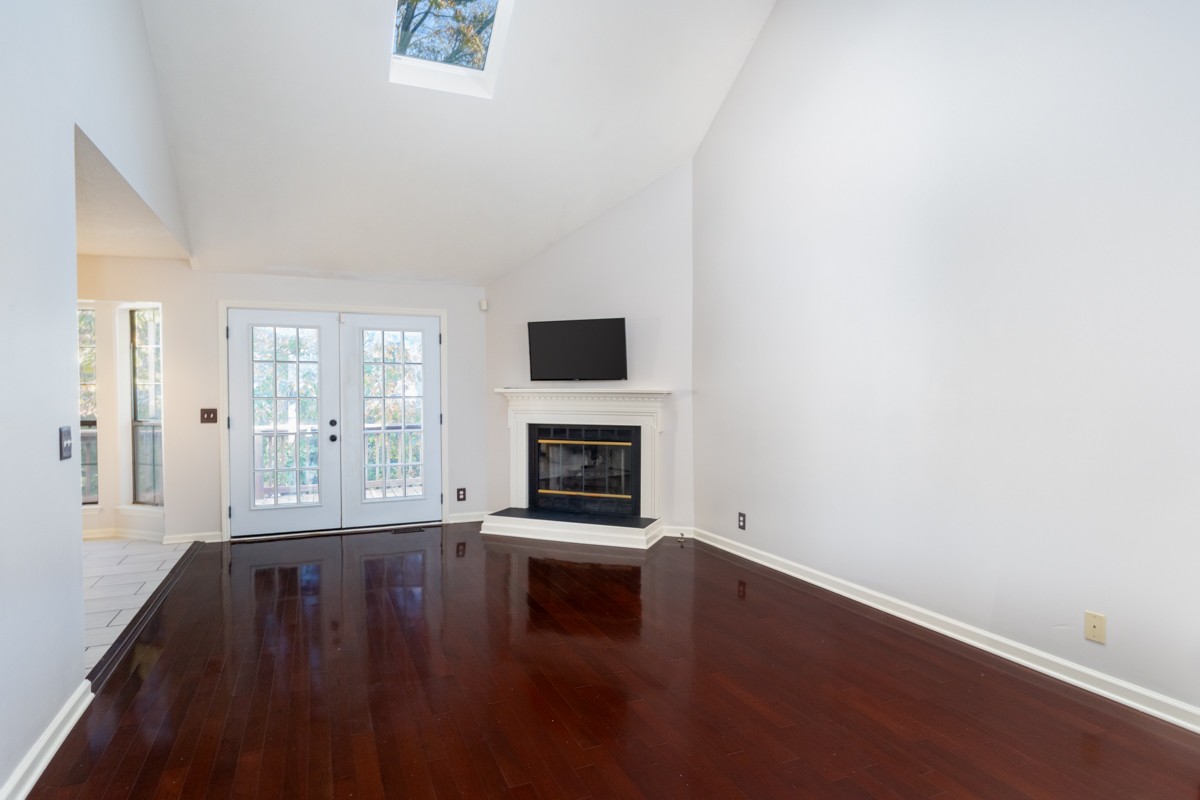 3817 Bryce Road Nashville, TN 37211 - Photo 3 of 26 wooden floor in an empty room with a fireplace