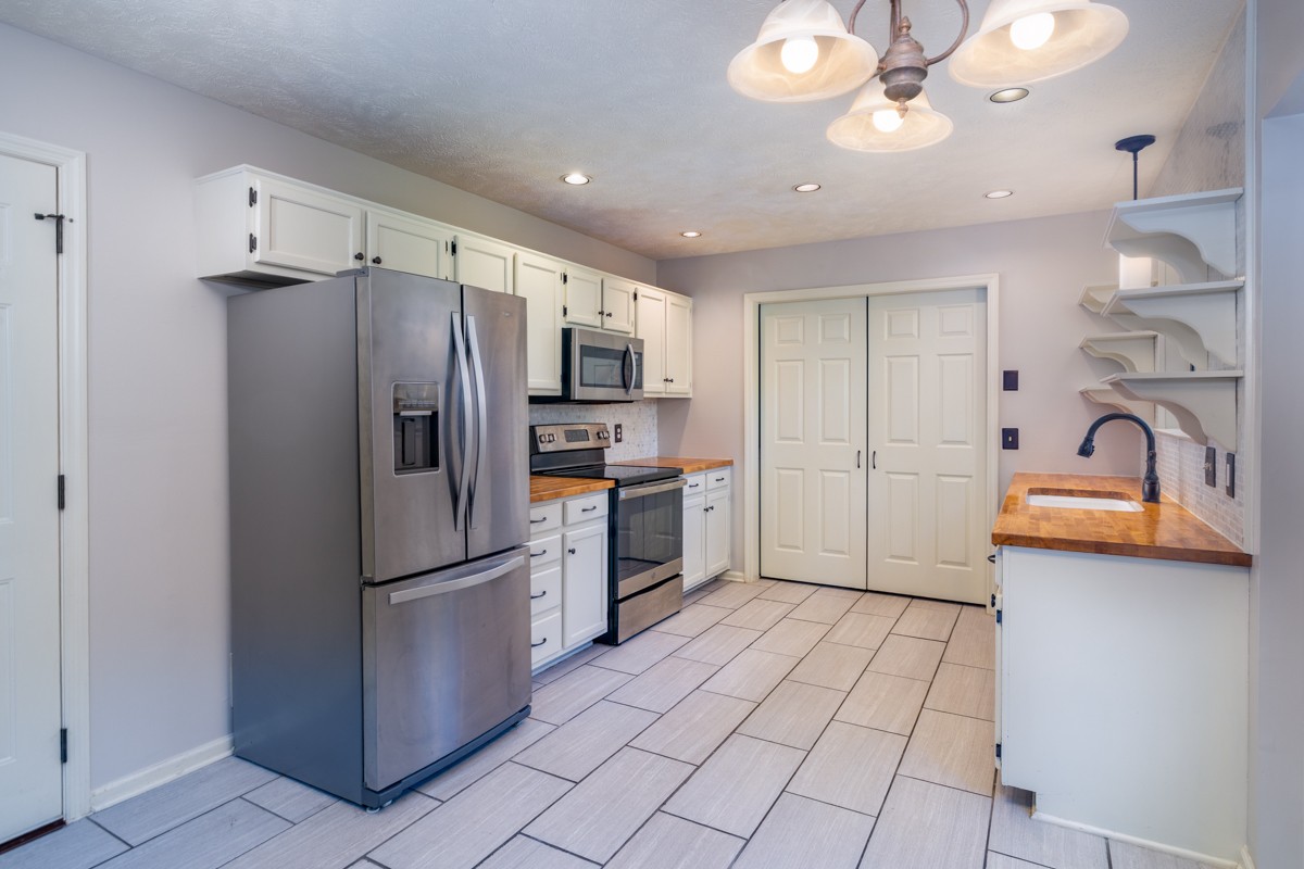 3817 Bryce Road Nashville, TN 37211 - Photo 5 of 26 a kitchen with stainless steel appliances a refrigerator sink and cabinets