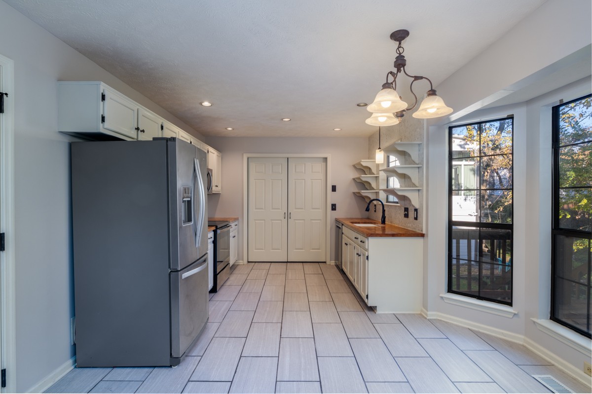 3817 Bryce Road Nashville, TN 37211 - Photo 6 of 26 a kitchen with stainless steel appliances granite countertop a refrigerator and a sink