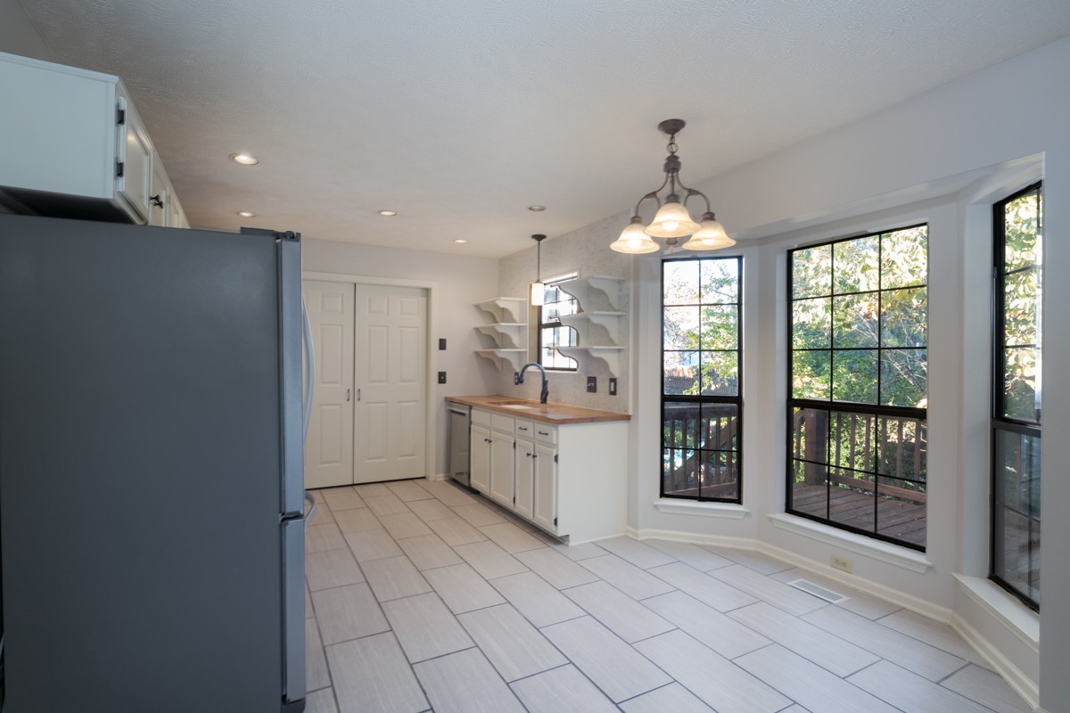 3817 Bryce Road Nashville, TN 37211 - Photo 7 of 26 a kitchen with a refrigerator and a sink