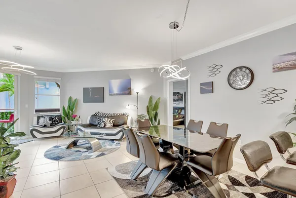 a dining room with furniture and a clock