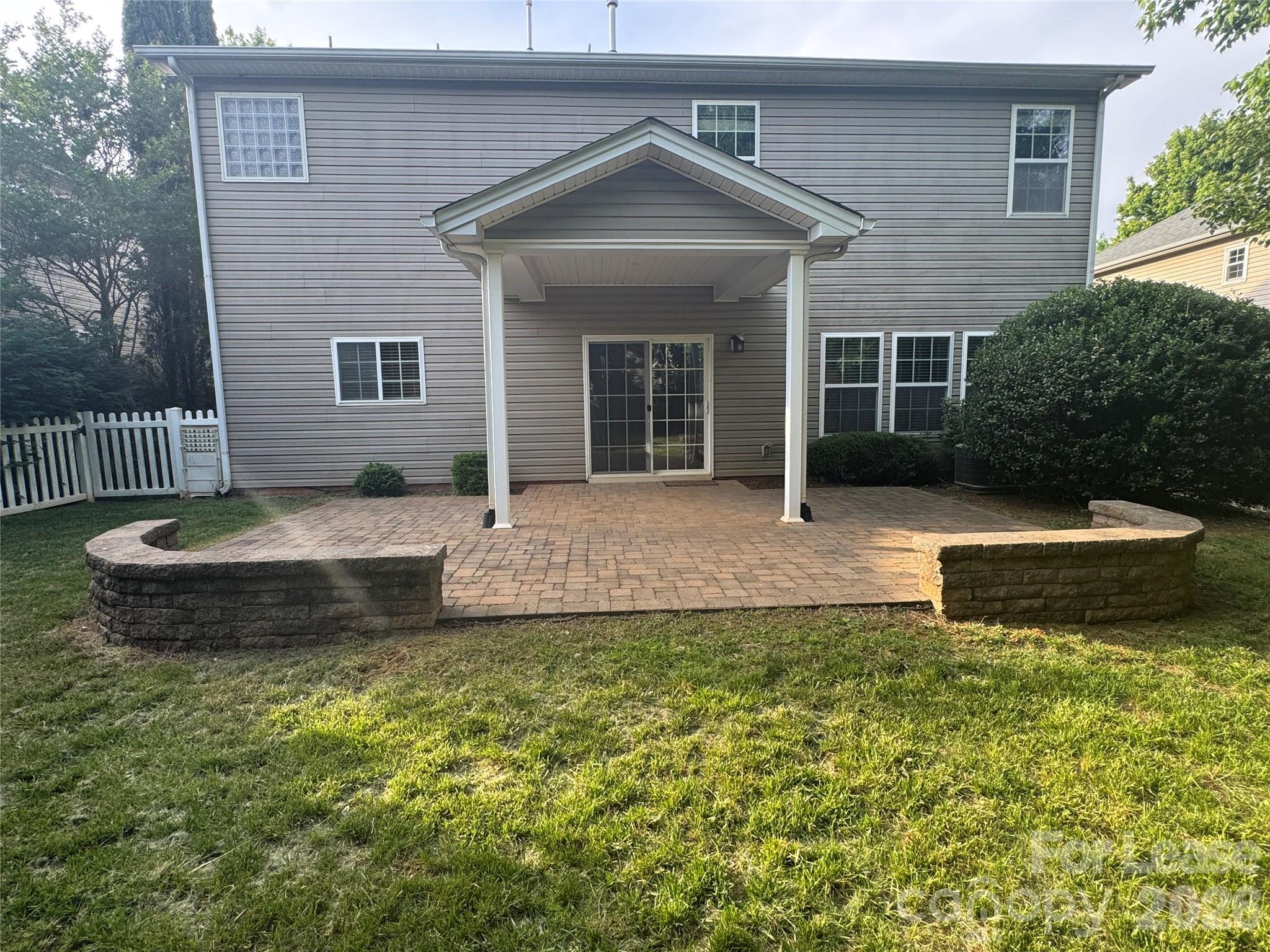 10921 Rousay Road Charlotte, NC 28278 - Photo 17 of 17 a front view of a house with a yard