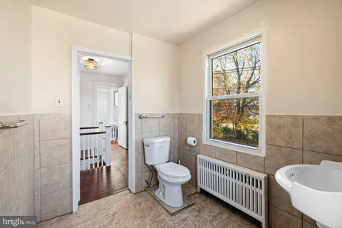 a bathroom with a toilet sink a shower and a bathtub