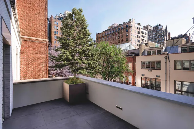 a view of a building from a balcony
