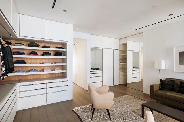 a kitchen with stainless steel appliances a refrigerator and wooden cabinets