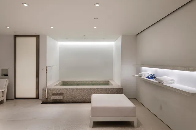 a bathroom with a tub and a shower