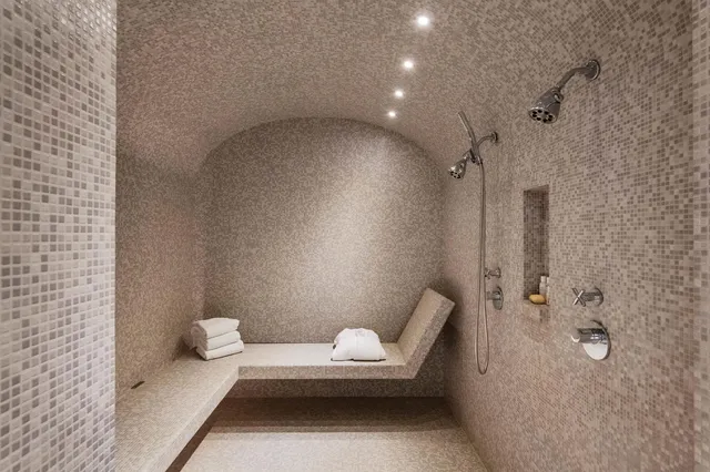 a bathroom with a bathtub and shower