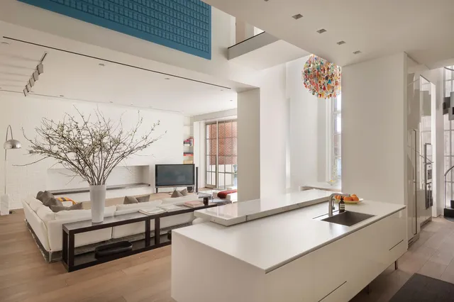 a view of living room with furniture and large window